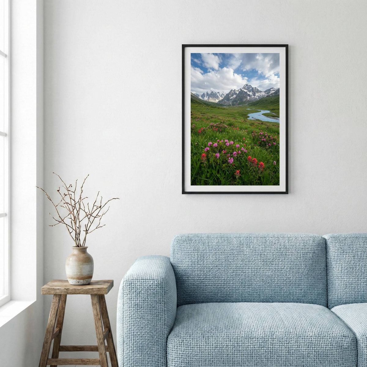 Pink wildflowers beside a mountain stream with snow-capped peaks beyond — framed canvas wall art in a wooden frame, 16×24 in