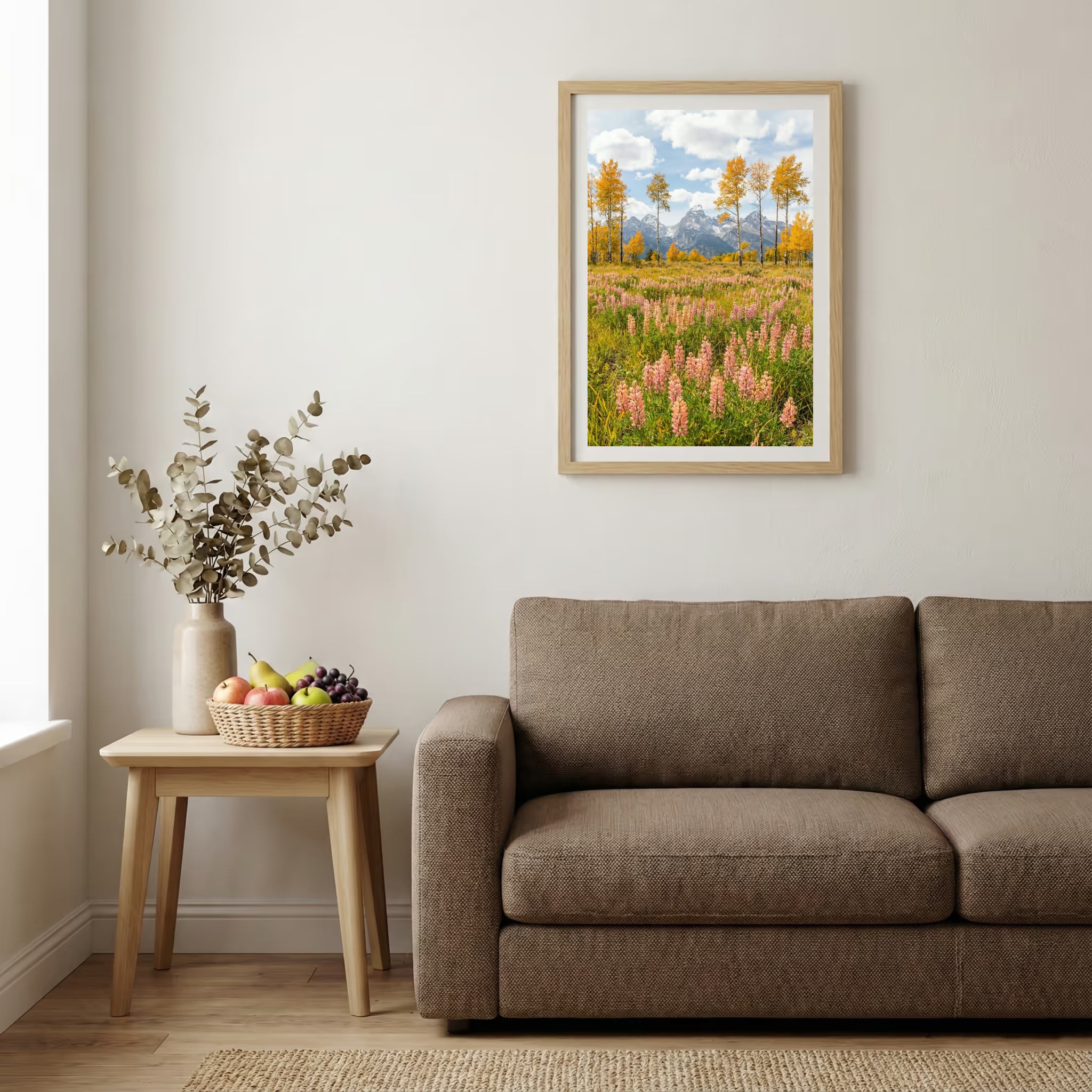 Jagged alpine peaks rising above a green valley dotted with autumn-colored trees — wooden-frame wall art print, 20×30 in