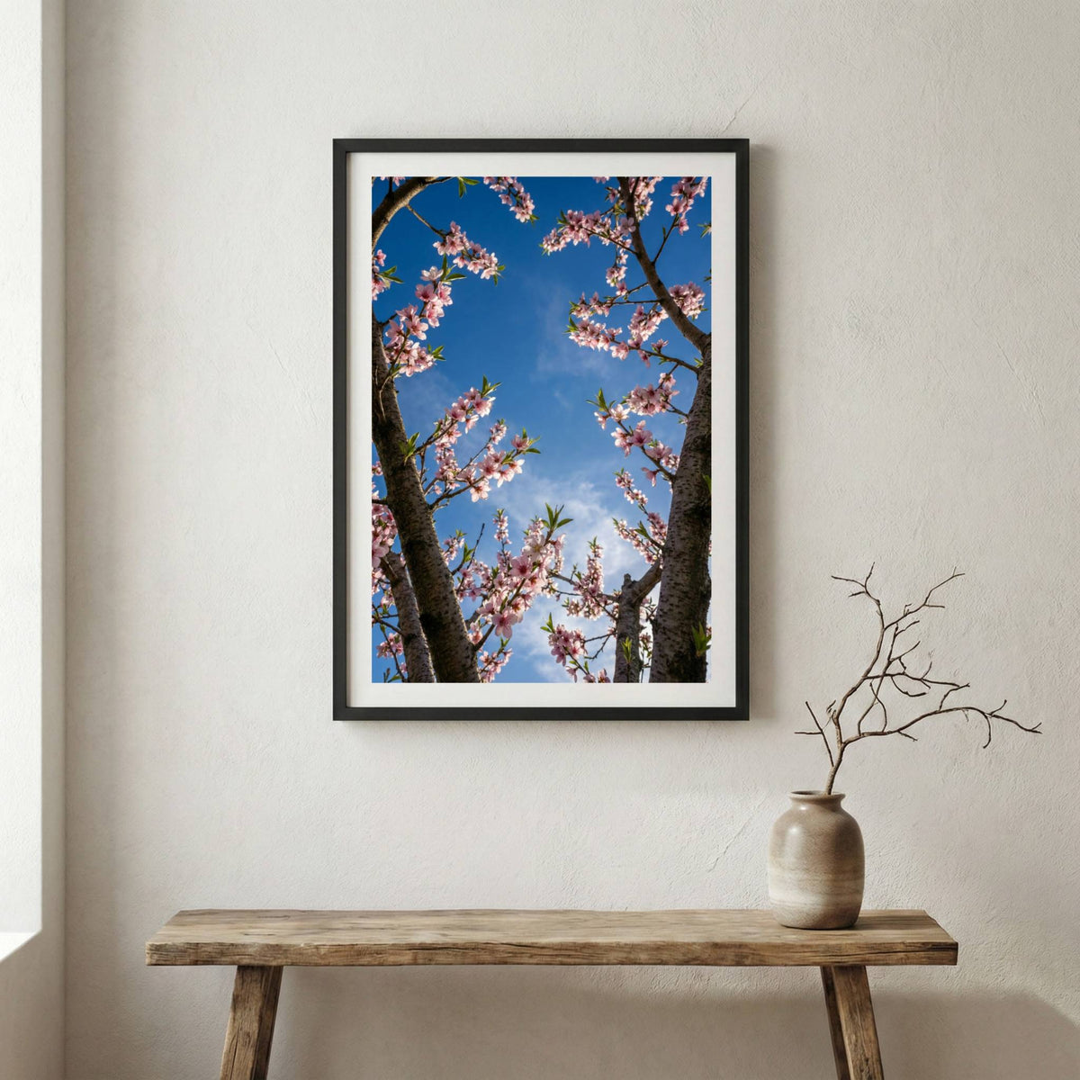 Pink blossom branches reaching into a vivid blue sky — wooden frame canvas wall art print, 12×18 in