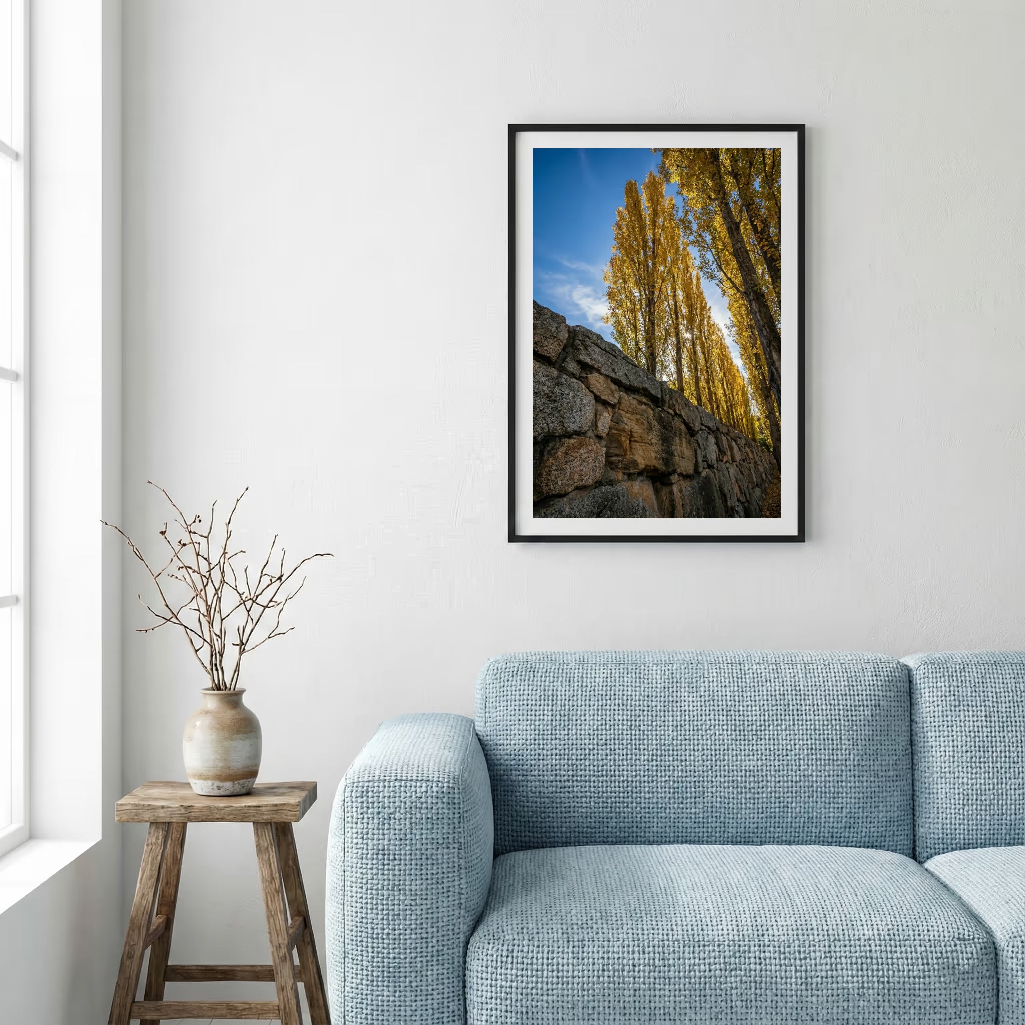 Pink blossom trees in a green meadow beneath snow-capped mountain peaks — framed canvas wall art in a wooden frame, 16×24 in