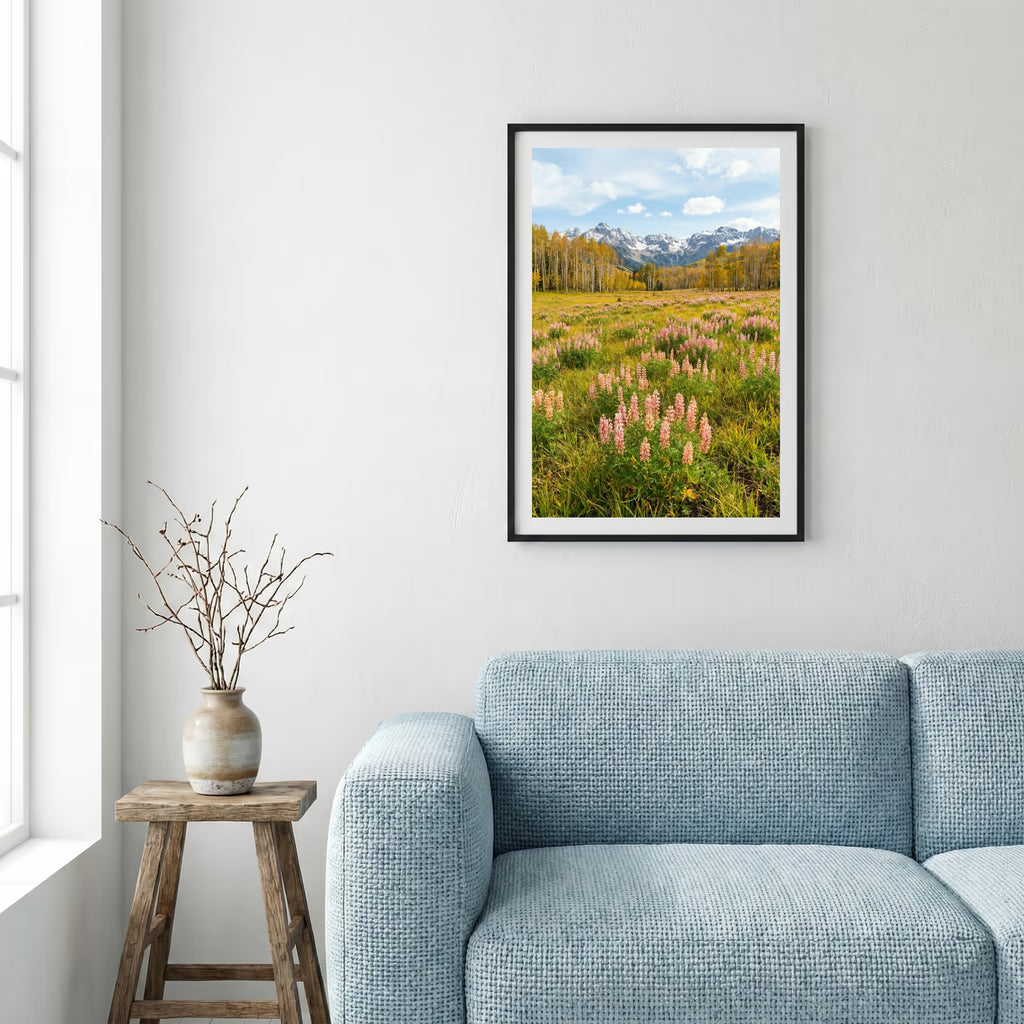 Aerial view of a valley in full bloom with pink blossom trees and a mountain backdrop — framed canvas wall art in a wooden frame, 16×24 in