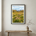 Aerial view of a valley in full bloom with pink blossom trees and a mountain backdrop — wooden frame canvas wall art print, 12×18 in
