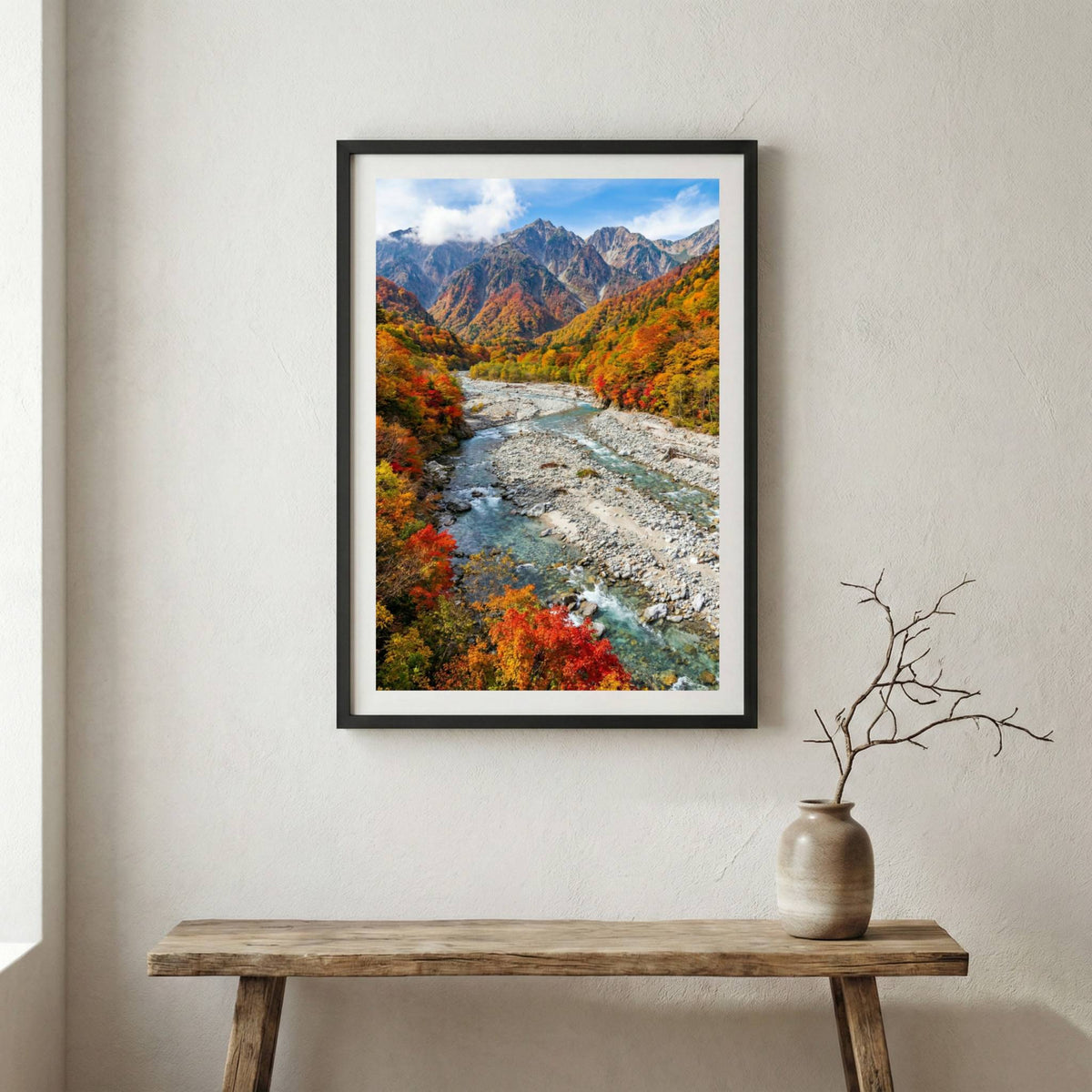 Vivid red and orange autumn foliage lining a turquoise mountain river — wooden frame canvas wall art print, 12×18 in