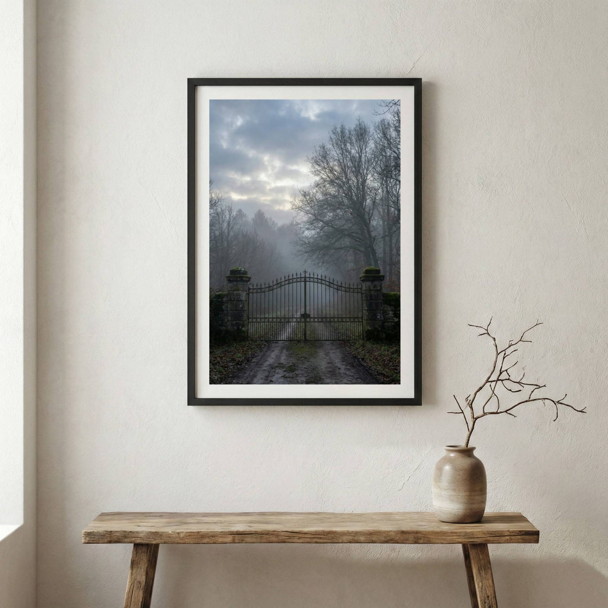 Old iron gate opening onto a foggy, tree-lined path — wooden frame canvas wall art print, 12×18 in