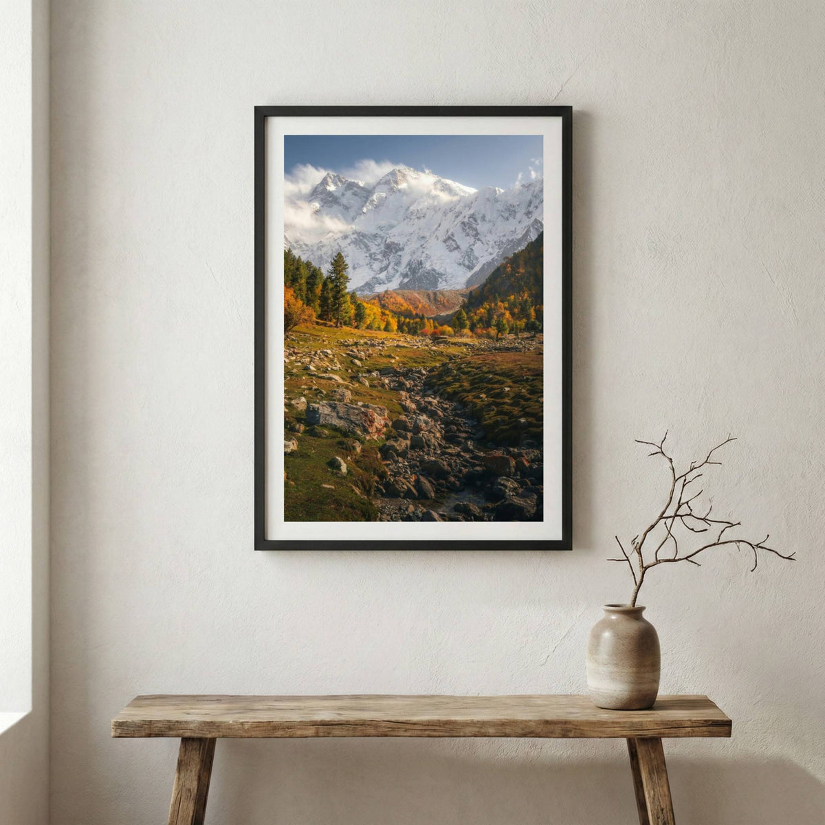 Golden autumn valley with evergreen trees and a snow-capped peak in the distance — wooden frame canvas wall art print, 12×18 in