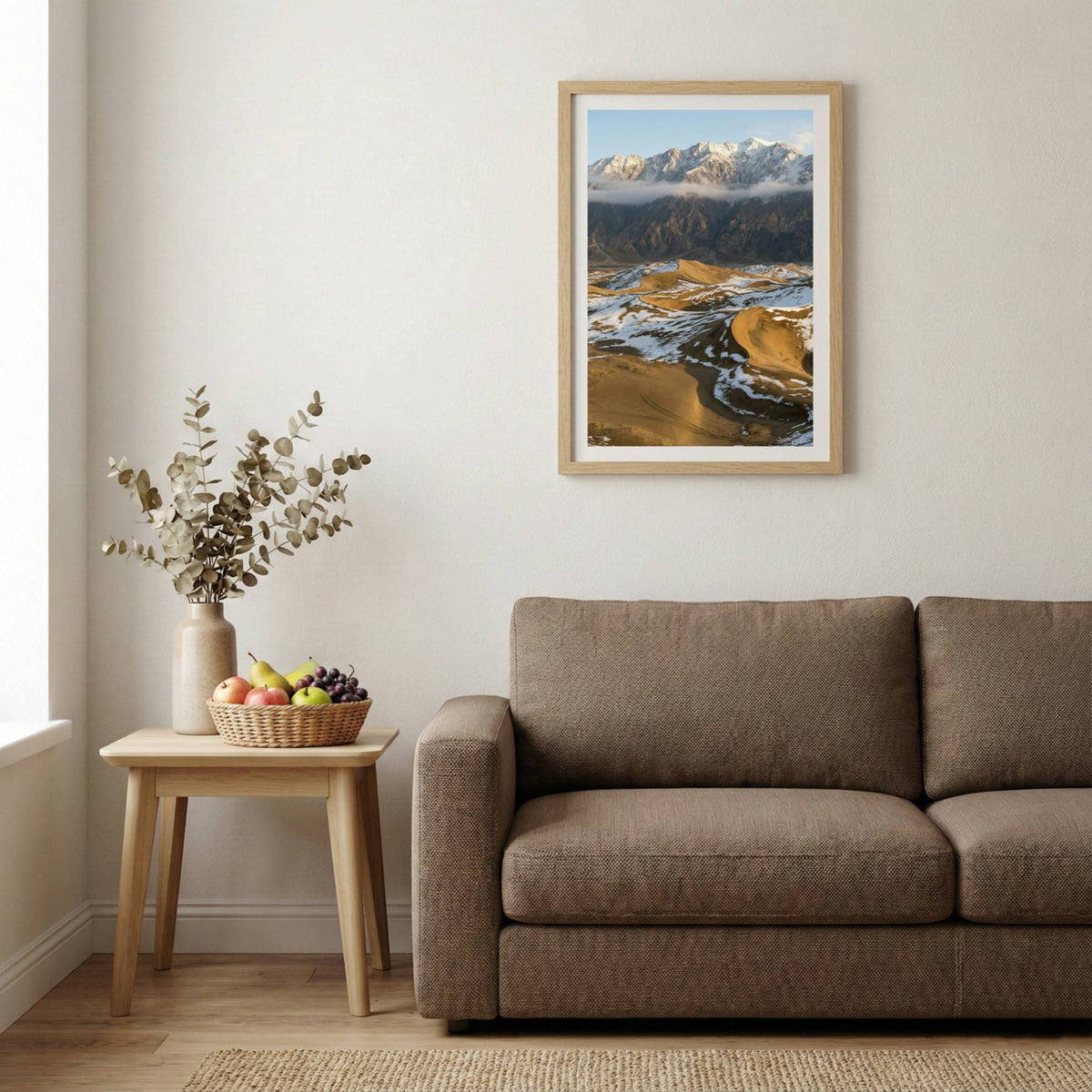 Aerial view of golden badlands terrain with a winding stream and patches of snow — wooden-frame wall art print, 20×30 in