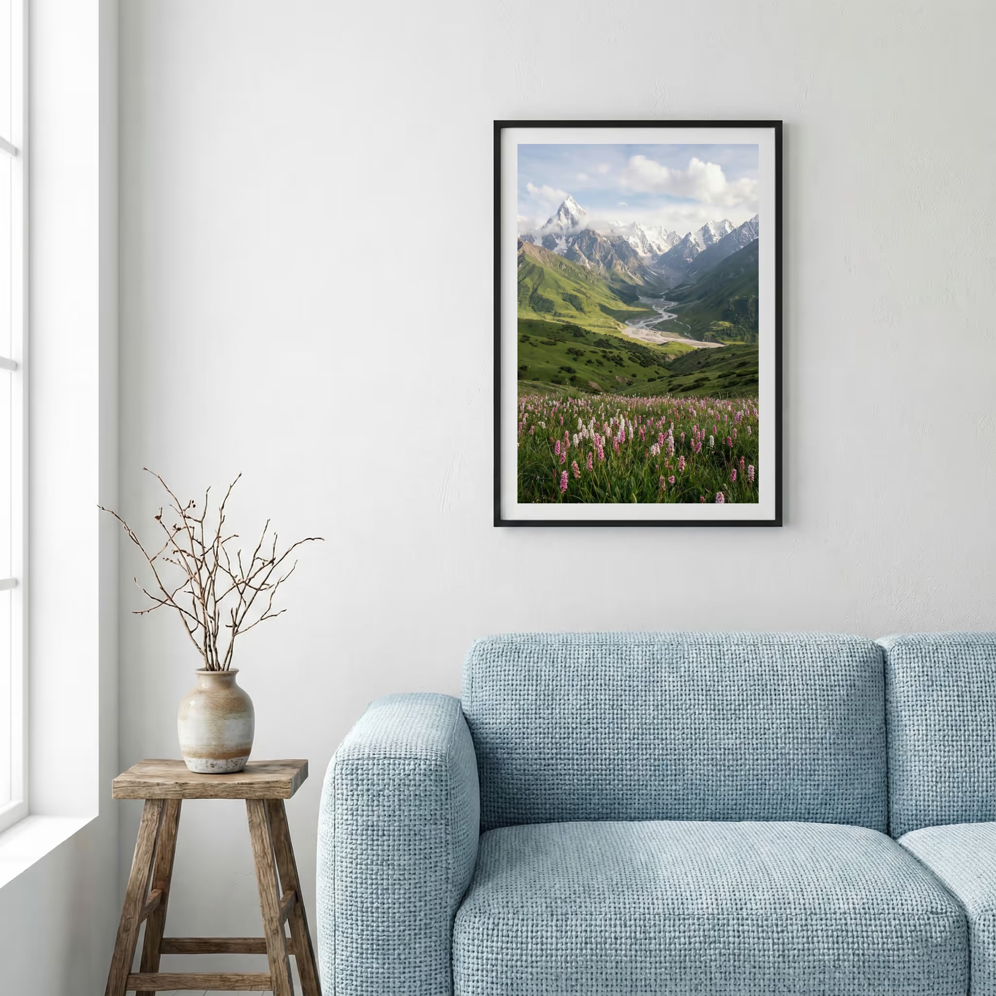 Aerial view of golden badlands terrain with a winding stream and patches of snow — framed canvas wall art in a wooden frame, 16×24 in
