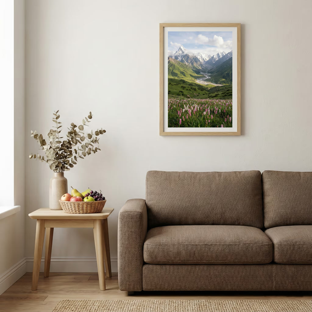 Aerial view of golden badlands terrain with a winding stream and patches of snow — wooden-frame wall art print, 20×30 in