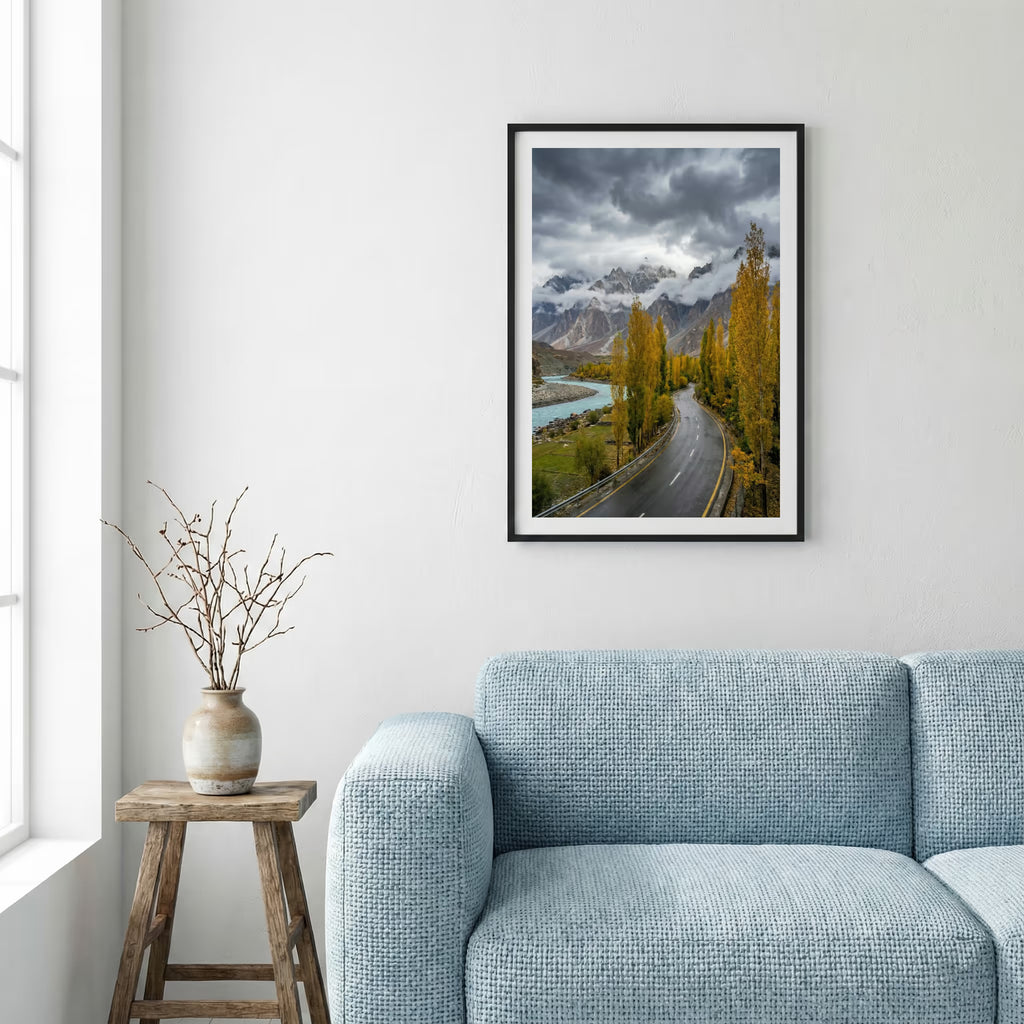 Dramatic sunset over snow-capped peaks above a red-gold valley and turquoise river — framed canvas wall art in a wooden frame, 16×24 in