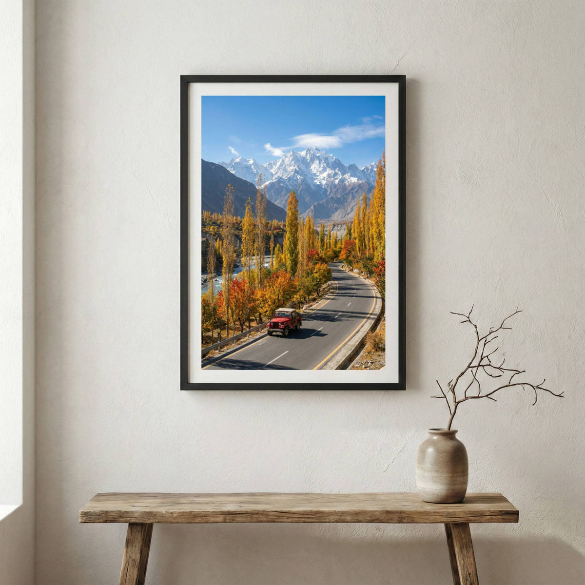 Car driving down a road lined with golden poplar trees toward the mountains — wooden frame canvas wall art print, 12×18 in