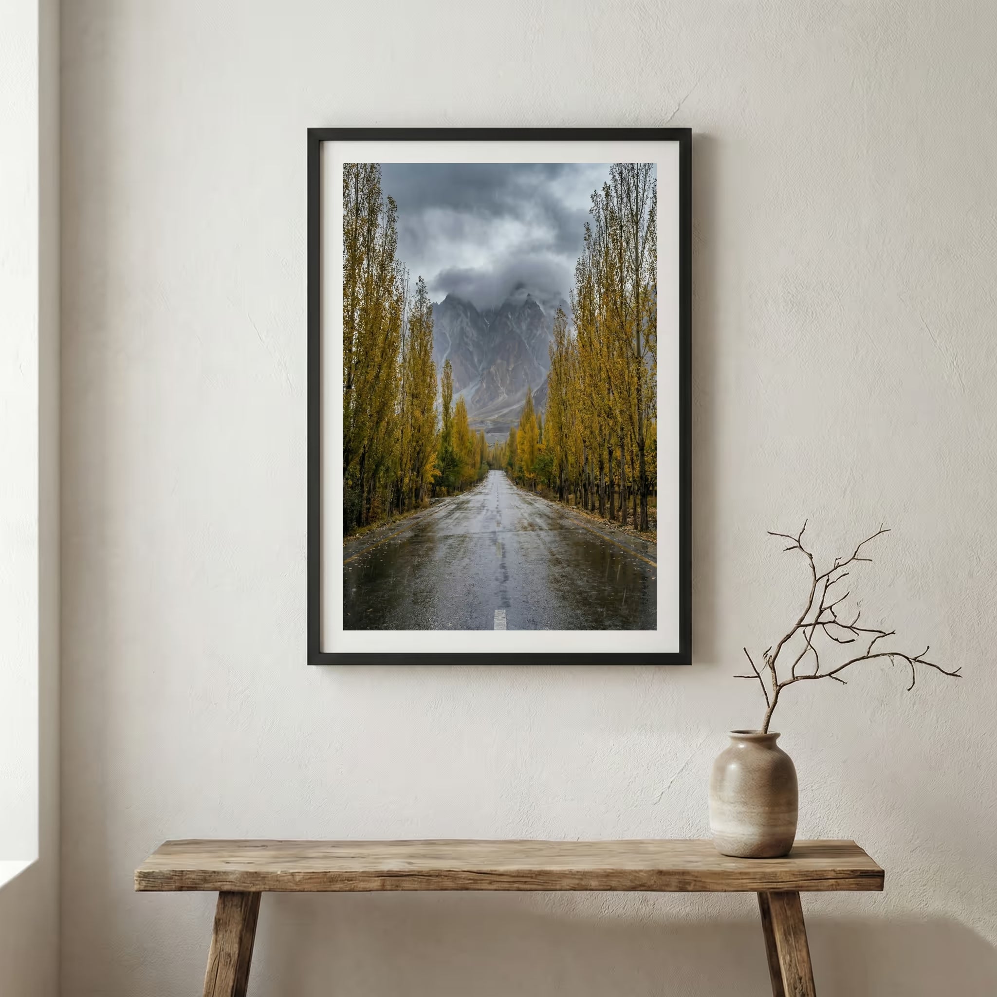 Stone-walled walkway lined with golden poplar trees leading toward the mountains — wooden frame canvas wall art print, 12×18 in