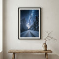 Aerial view of a road through golden trees lit by streaming morning sunbeams — wooden frame canvas wall art print, 12×18 in