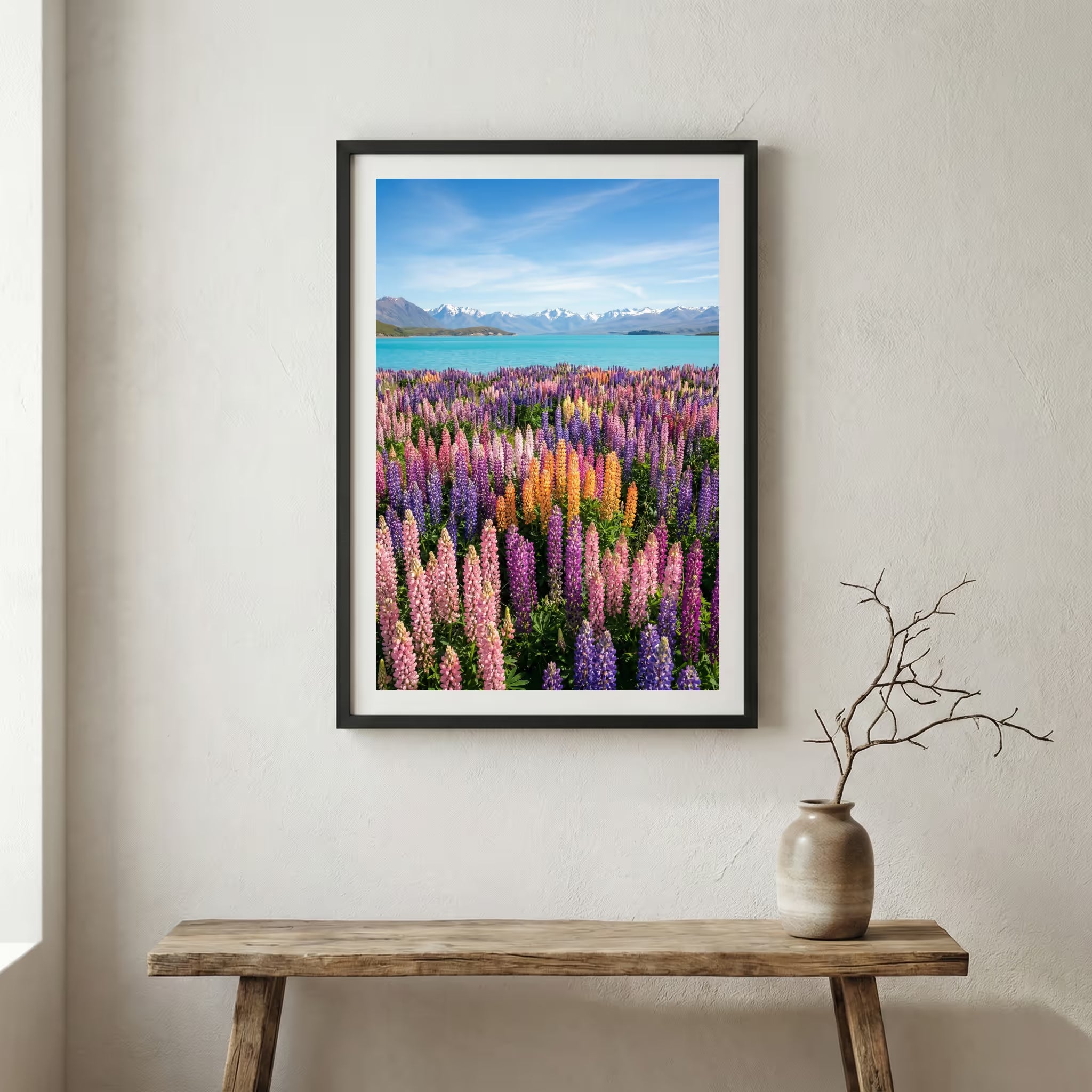 Lone bare tree on rippled desert dunes with distant snow-capped mountains — wooden frame canvas wall art print, 12×18 in