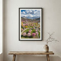 Pink lupine flowers across a green meadow with snow-capped peaks beyond — wooden frame canvas wall art print, 12×18 in
