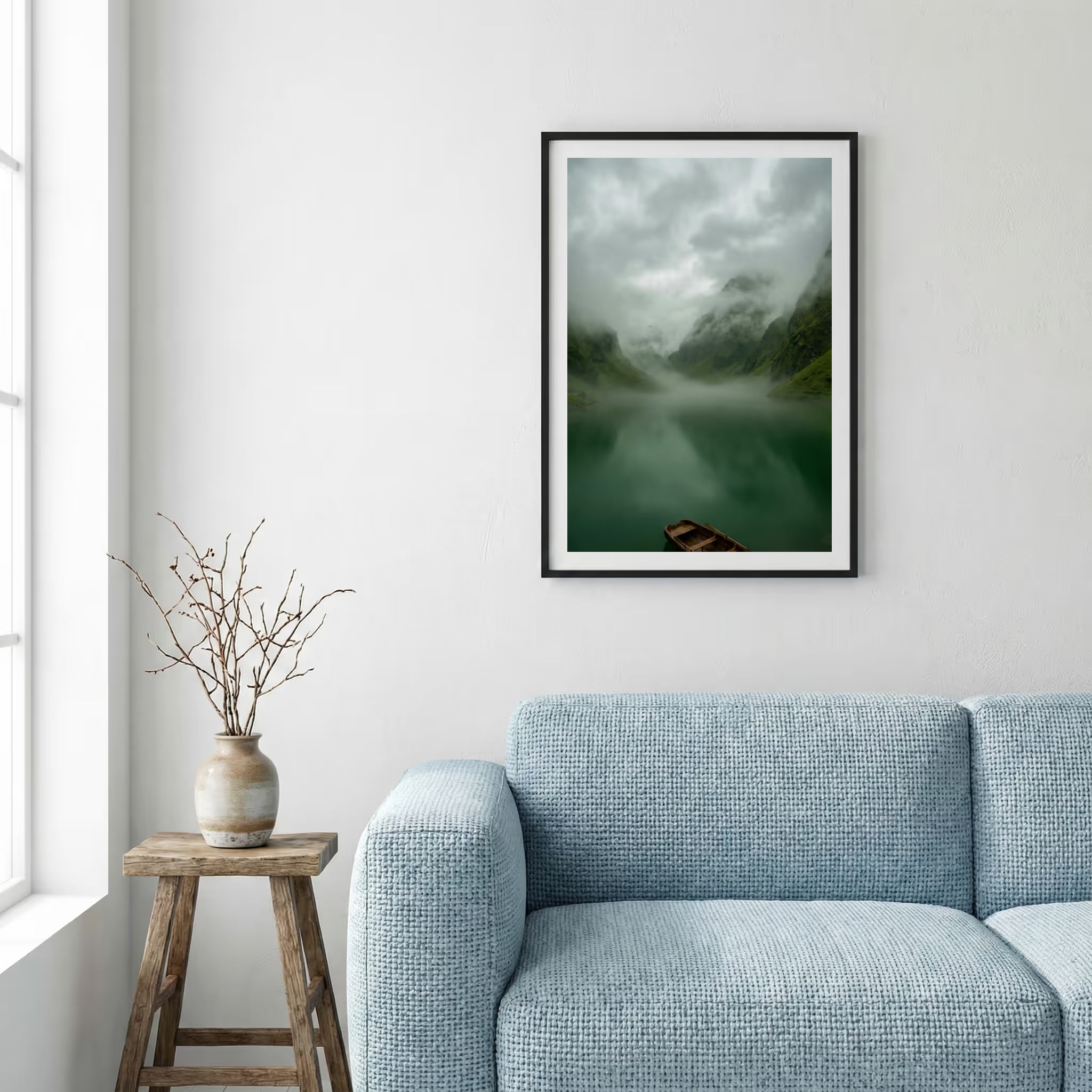 Snow-covered wooden cabin set against jagged, snow-capped mountains — framed canvas wall art in a wooden frame, 16×24 in