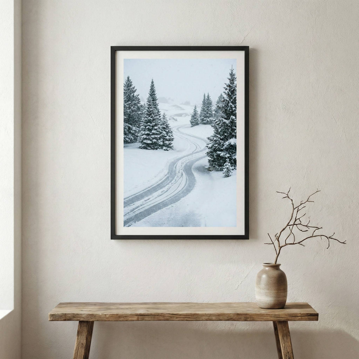 Snow-covered pine trees lining a winding winter road — wooden frame canvas wall art print, 12×18 in