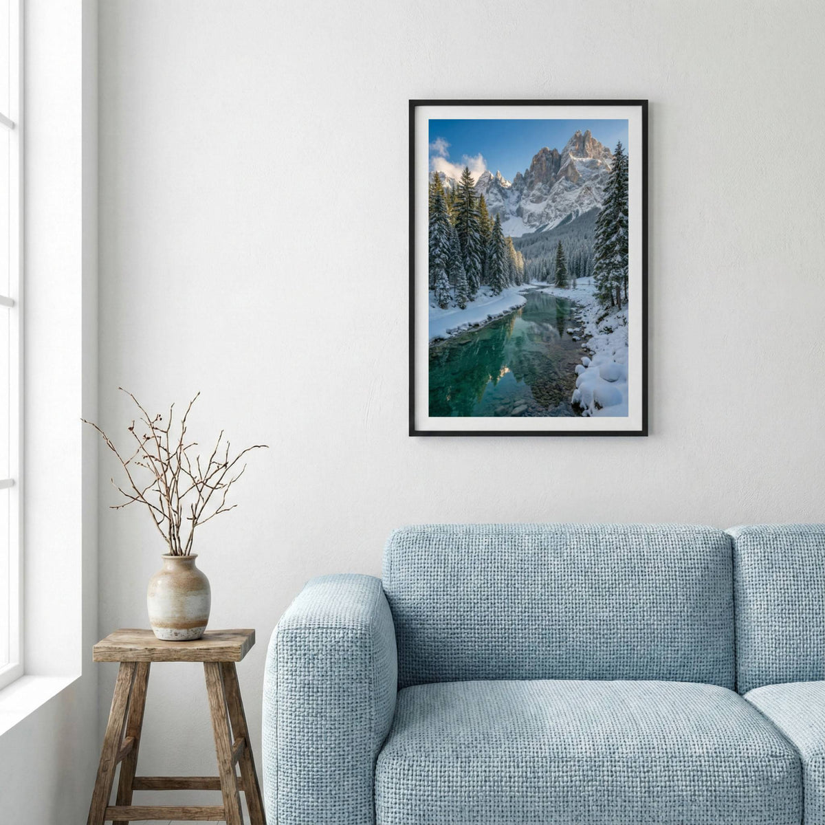 Snow-covered pine trees along a turquoise river beneath jagged snowy peaks — framed canvas wall art in a wooden frame, 16×24 in