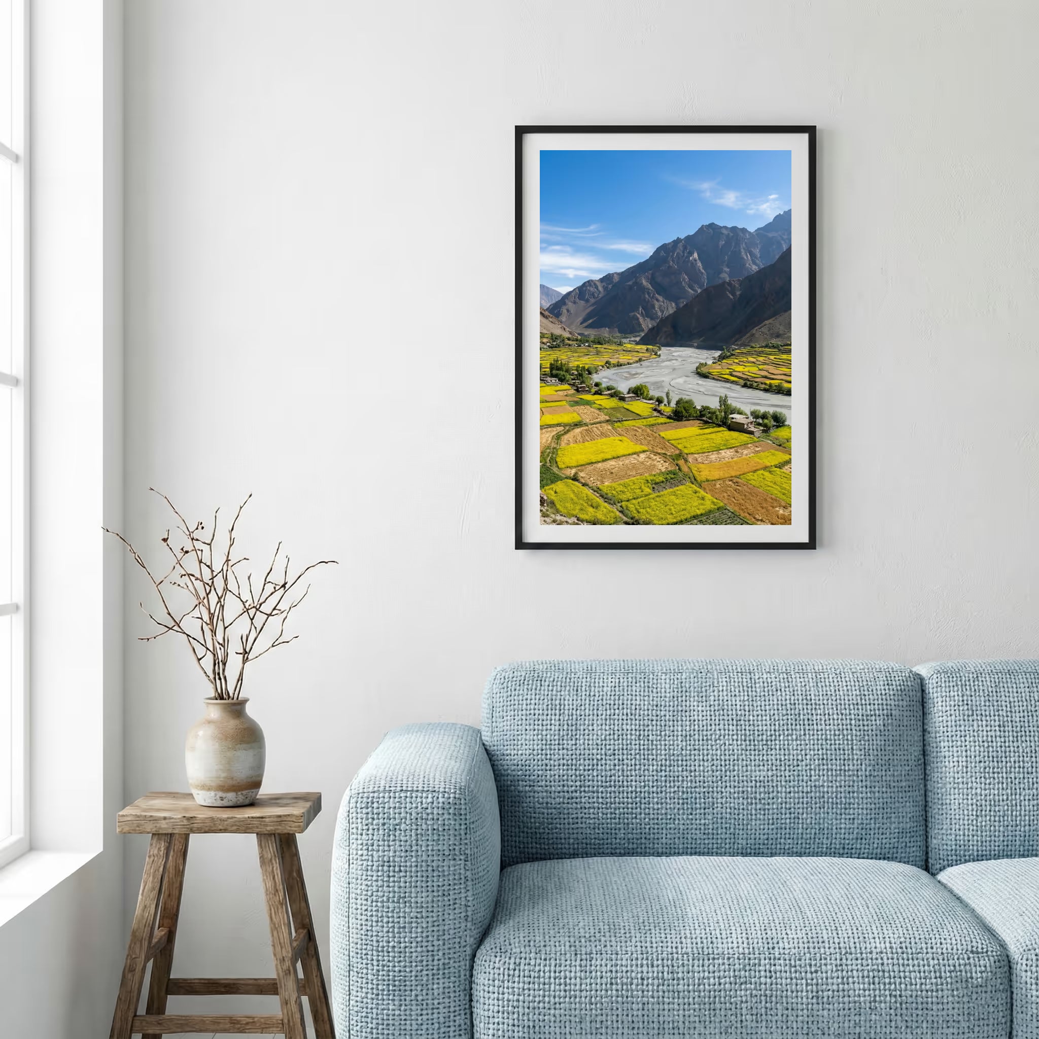 Snow-covered pine trees along a turquoise river beneath jagged snowy peaks — framed canvas wall art in a wooden frame, 16×24 in