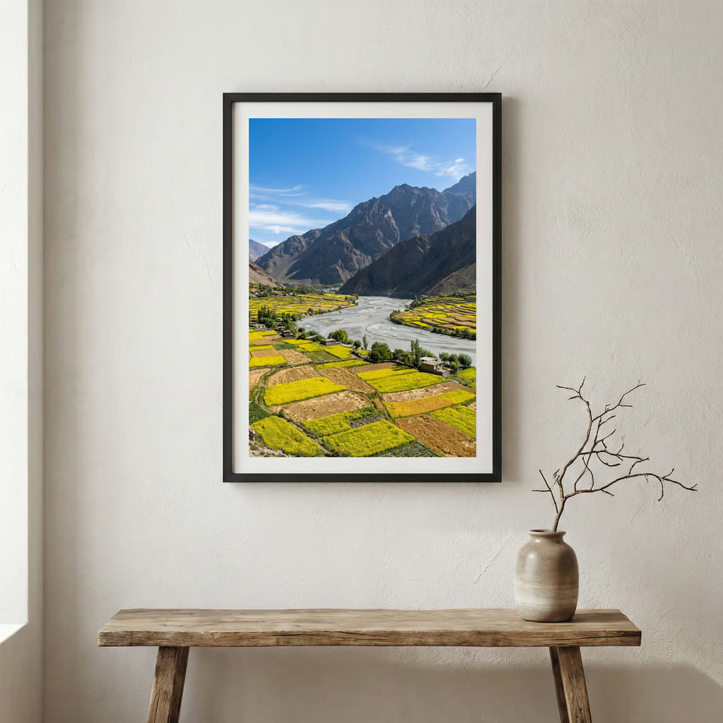 Snow-covered pine trees along a turquoise river beneath jagged snowy peaks — wooden frame canvas wall art print, 12×18 in