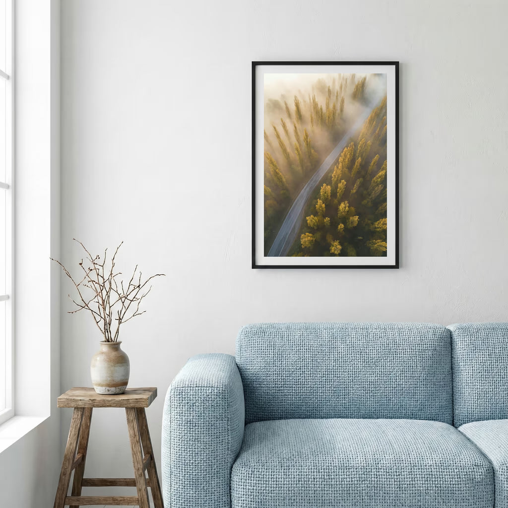 Milky Way star trail over a snow-covered road lined with dark trees — framed canvas wall art in a wooden frame, 16×24 in
