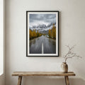 Swans gliding across a frozen lake beneath snow-capped mountains — wooden frame canvas wall art print, 12×18 in