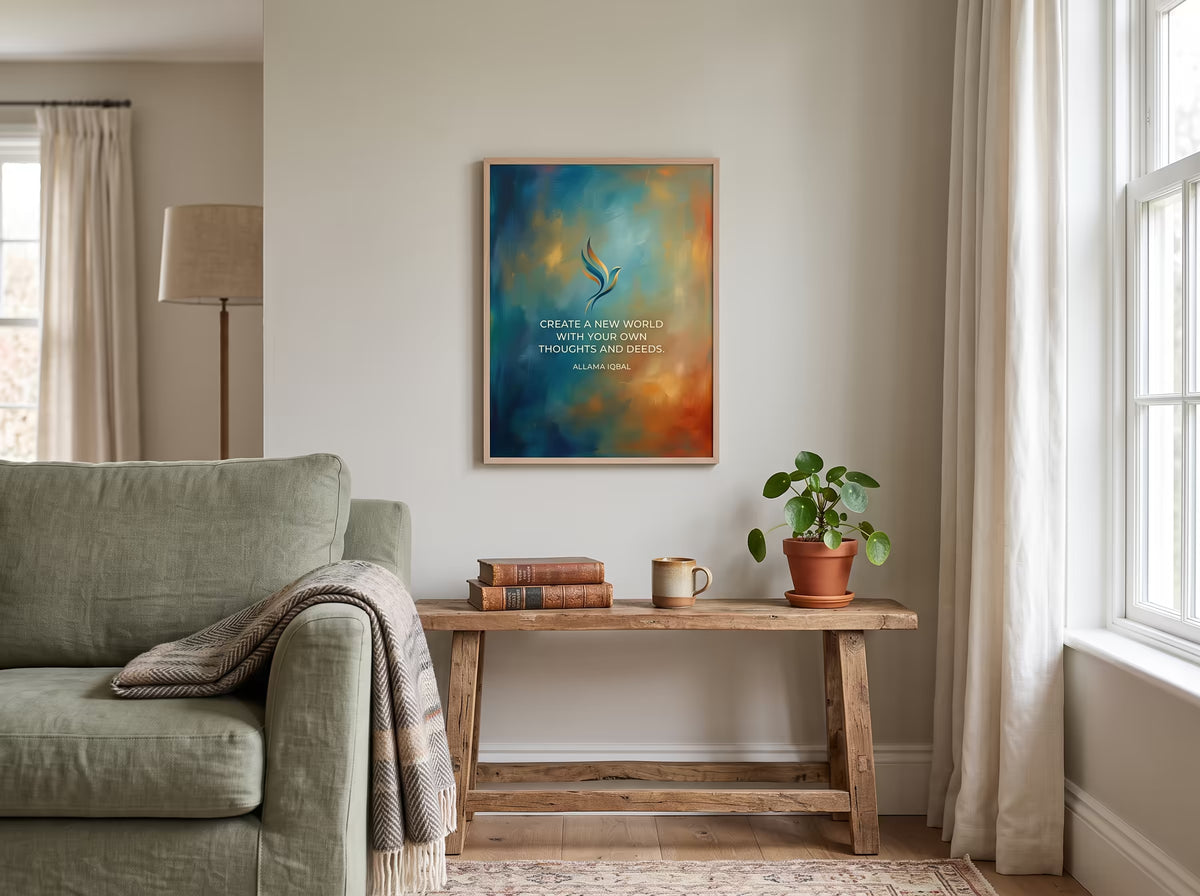 A framed abstract art print with a quote hangs on a beige wall in a styled living room setting, above a rustic wooden console table with a potted plant and books.