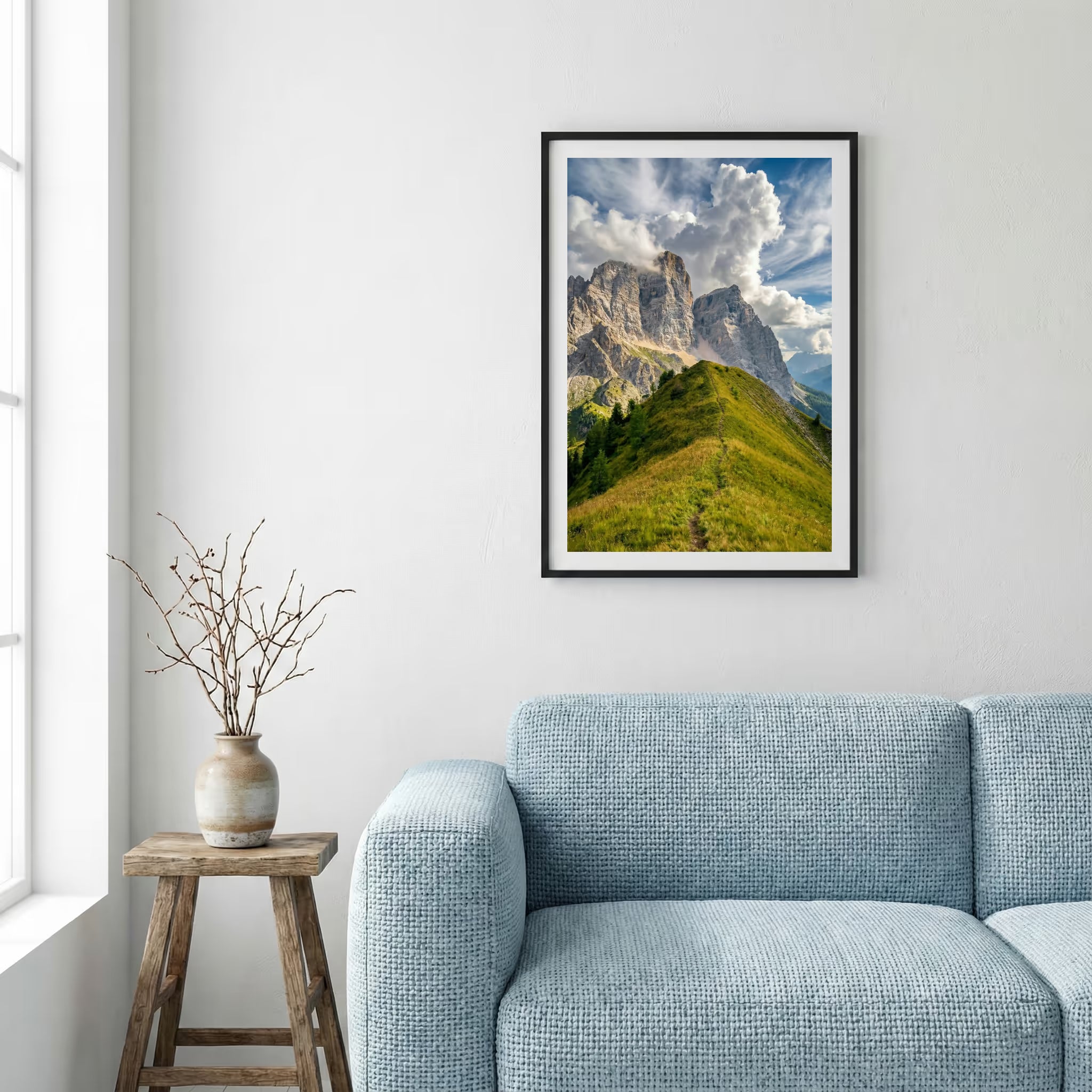Jagged rocky peak rising above a green grassy ridge trail under a blue sky — framed canvas wall art in a wooden frame, 16×24 in
