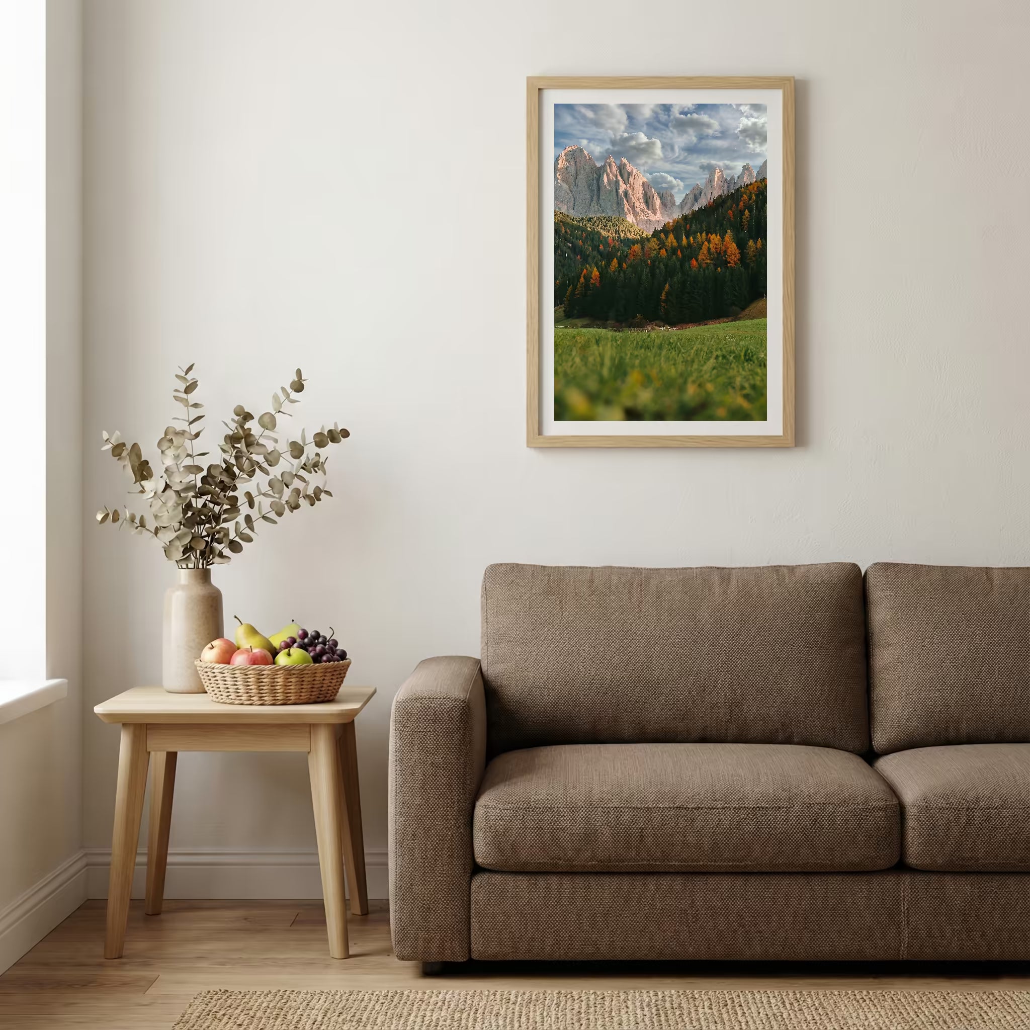 Jagged alpine peaks rising above a green valley dotted with autumn-colored trees — wooden-frame wall art print, 20×30 in