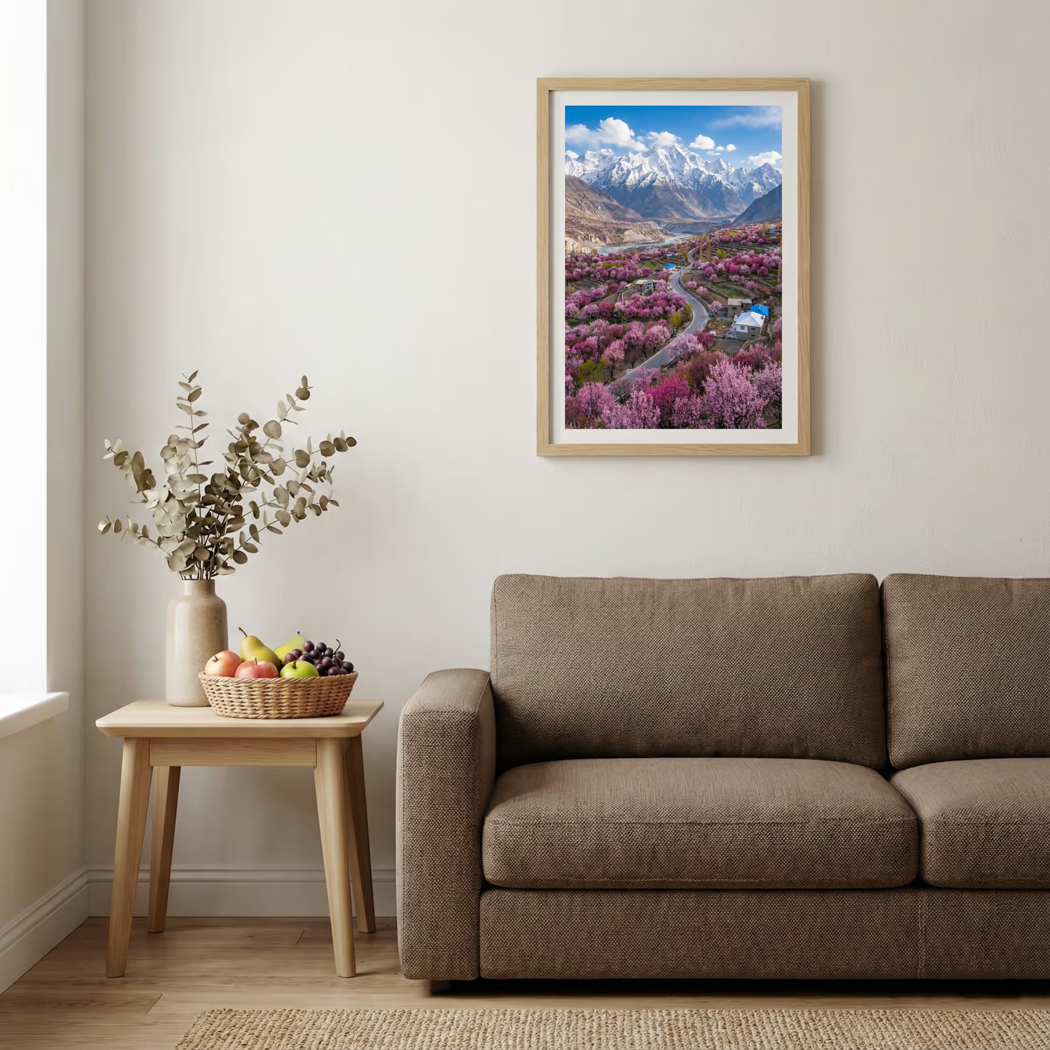 Aerial view of a blossoming valley with a road and a snow-capped mountain beyond — wooden-frame wall art print, 20×30 in